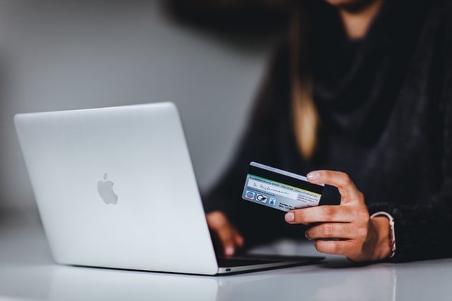 Using a laptop to pay online with a credit card